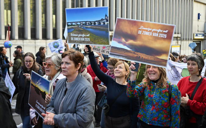 Tens of thousands march in Brussels demanding stronger climate action BRUSSELS, BELGIUM - OCTOBER 11: Demonstrators hold climate-themed placards as tens of thousands of people march through Brussels calling for stronger action against climate change and reduced dependence on fossil fuels, on October 11, 2026 in Brussels, Belgium. The protest was organized by the Belgian Climate Coalition, which brings together around 100 civil society organizations. Participants marched along major roads toward Schuman Square, home to several European Union institutions, while protesting the government s climate policies. Dursun Aydemir Anadolu Brussels Belgium. Editorial use only. Please get in touch for any other usage.  Copyright: x2026xAnadoluxDursunxAydemirx