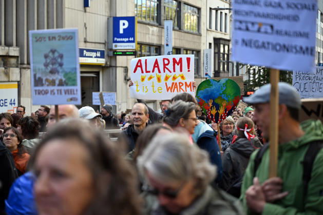 Tens of thousands march in Brussels demanding stronger climate action BRUSSELS, BELGIUM - OCTOBER 11: Demonstrators hold climate-themed placards as tens of thousands of people march through Brussels calling for stronger action against climate change and reduced dependence on fossil fuels, on October 11, 2026 in Brussels, Belgium. The protest was organized by the Belgian Climate Coalition, which brings together around 100 civil society organizations. Participants marched along major roads toward Schuman Square, home to several European Union institutions, while protesting the government s climate policies. Dursun Aydemir Anadolu Brussels Belgium. Editorial use only. Please get in touch for any other usage.  Copyright: x2026xAnadoluxDursunxAydemirx
