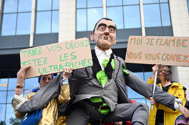 Tens of thousands march in Brussels demanding stronger climate action BRUSSELS, BELGIUM - OCTOBER 11: Demonstrators hold climate-themed placards as tens of thousands of people march through Brussels calling for stronger action against climate change and reduced dependence on fossil fuels, on October 11, 2026 in Brussels, Belgium. The protest was organized by the Belgian Climate Coalition, which brings together around 100 civil society organizations. Participants marched along major roads toward Schuman Square, home to several European Union institutions, while protesting the government s climate policies. Dursun Aydemir Anadolu Brussels Belgium. Editorial use only. Please get in touch for any other usage.  Copyright: x2026xAnadoluxDursunxAydemirx