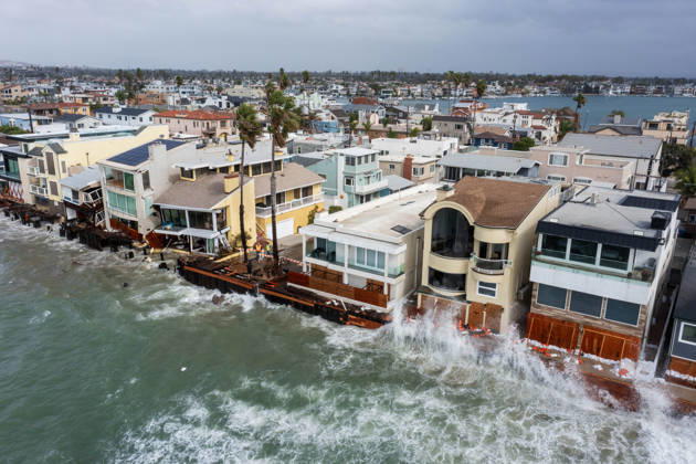 October 11, 2006, Long Beach, California, USA: The Long Beach Peninsula is facing severe, structural devastation as Tropical Storm Rachel batters the Southern California coast. Driven by a developing El Nino pattern, this is the fourth major storm system to slam the shoreline in six weeks. Waves and unusually high tides have shattered a 30-foot section of the protective wooden bulkhead, completely shredding the historic boardwalk and allowing seawater to surge directly onto interior streets. Flooding has swamped coastal neighborhoods, forcing mandatory evacuations along oceanfront blocks like Seaside Walk. Emergency crews are working to stack thousands of sandbags and reinforce coastal defenses, but city inspectors have already been forced - ZUMAr19_ 20261011_new_r19_126 Copyright: xRuaridhxStewartx