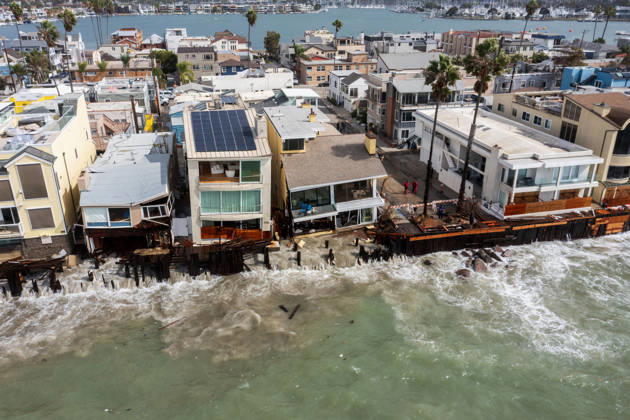October 11, 2006, Long Beach, California, USA: The Long Beach Peninsula is facing severe, structural devastation as Tropical Storm Rachel batters the Southern California coast. Driven by a developing El Nino pattern, this is the fourth major storm system to slam the shoreline in six weeks. Waves and unusually high tides have shattered a 30-foot section of the protective wooden bulkhead, completely shredding the historic boardwalk and allowing seawater to surge directly onto interior streets. Flooding has swamped coastal neighborhoods, forcing mandatory evacuations along oceanfront blocks like Seaside Walk. Emergency crews are working to stack thousands of sandbags and reinforce coastal defenses, but city inspectors have already been forced - ZUMAr19_ 20261011_new_r19_133 Copyright: xRuaridhxStewartx