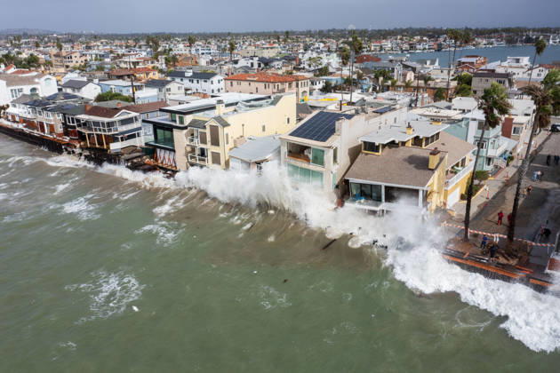 October 11, 2006, Long Beach, California, USA: The Long Beach Peninsula is facing severe, structural devastation as Tropical Storm Rachel batters the Southern California coast. Driven by a developing El Nino pattern, this is the fourth major storm system to slam the shoreline in six weeks. Waves and unusually high tides have shattered a 30-foot section of the protective wooden bulkhead, completely shredding the historic boardwalk and allowing seawater to surge directly onto interior streets. Flooding has swamped coastal neighborhoods, forcing mandatory evacuations along oceanfront blocks like Seaside Walk. Emergency crews are working to stack thousands of sandbags and reinforce coastal defenses, but city inspectors have already been forced - ZUMAr19_ 20261011_new_r19_132 Copyright: xRuaridhxStewartx