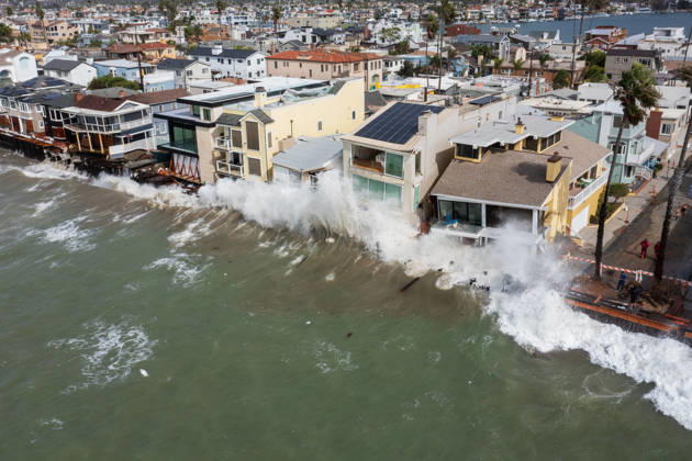 October 11, 2006, Long Beach, California, USA: The Long Beach Peninsula is facing severe, structural devastation as Tropical Storm Rachel batters the Southern California coast. Driven by a developing El Nino pattern, this is the fourth major storm system to slam the shoreline in six weeks. Waves and unusually high tides have shattered a 30-foot section of the protective wooden bulkhead, completely shredding the historic boardwalk and allowing seawater to surge directly onto interior streets. Flooding has swamped coastal neighborhoods, forcing mandatory evacuations along oceanfront blocks like Seaside Walk. Emergency crews are working to stack thousands of sandbags and reinforce coastal defenses, but city inspectors have already been forced - ZUMAr19_ 20261011_new_r19_131 Copyright: xRuaridhxStewartx