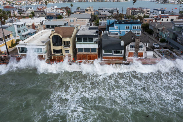 October 11, 2006, Long Beach, California, USA: The Long Beach Peninsula is facing severe, structural devastation as Tropical Storm Rachel batters the Southern California coast. Driven by a developing El Nino pattern, this is the fourth major storm system to slam the shoreline in six weeks. Waves and unusually high tides have shattered a 30-foot section of the protective wooden bulkhead, completely shredding the historic boardwalk and allowing seawater to surge directly onto interior streets. Flooding has swamped coastal neighborhoods, forcing mandatory evacuations along oceanfront blocks like Seaside Walk. Emergency crews are working to stack thousands of sandbags and reinforce coastal defenses, but city inspectors have already been forced - ZUMAr19_ 20261011_new_r19_137 Copyright: xRuaridhxStewartx