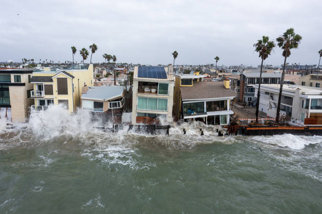 October 11, 2006, Long Beach, California, USA: The Long Beach Peninsula is facing severe, structural devastation as Tropical Storm Rachel batters the Southern California coast. Driven by a developing El Nino pattern, this is the fourth major storm system to slam the shoreline in six weeks. Waves and unusually high tides have shattered a 30-foot section of the protective wooden bulkhead, completely shredding the historic boardwalk and allowing seawater to surge directly onto interior streets. Flooding has swamped coastal neighborhoods, forcing mandatory evacuations along oceanfront blocks like Seaside Walk. Emergency crews are working to stack thousands of sandbags and reinforce coastal defenses, but city inspectors have already been forced - ZUMAr19_ 20261011_new_r19_140 Copyright: xRuaridhxStewartx