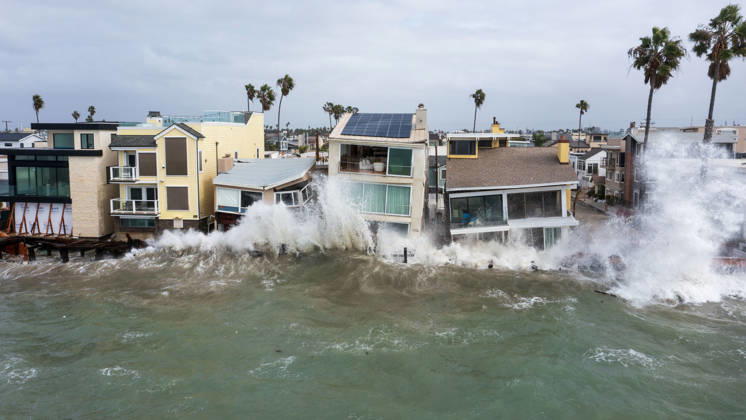 October 11, 2006, Long Beach, California, USA: The Long Beach Peninsula is facing severe, structural devastation as Tropical Storm Rachel batters the Southern California coast. Driven by a developing El Nino pattern, this is the fourth major storm system to slam the shoreline in six weeks. Waves and unusually high tides have shattered a 30-foot section of the protective wooden bulkhead, completely shredding the historic boardwalk and allowing seawater to surge directly onto interior streets. Flooding has swamped coastal neighborhoods, forcing mandatory evacuations along oceanfront blocks like Seaside Walk. Emergency crews are working to stack thousands of sandbags and reinforce coastal defenses, but city inspectors have already been forced - ZUMAr19_ 20261011_new_r19_143 Copyright: xRuaridhxStewartx