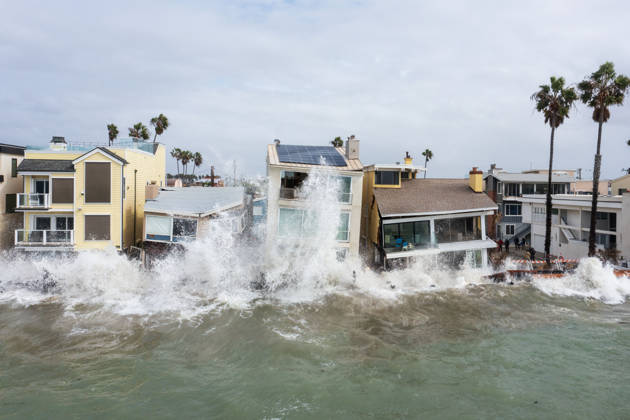 October 11, 2006, Long Beach, California, USA: The Long Beach Peninsula is facing severe, structural devastation as Tropical Storm Rachel batters the Southern California coast. Driven by a developing El Nino pattern, this is the fourth major storm system to slam the shoreline in six weeks. Waves and unusually high tides have shattered a 30-foot section of the protective wooden bulkhead, completely shredding the historic boardwalk and allowing seawater to surge directly onto interior streets. Flooding has swamped coastal neighborhoods, forcing mandatory evacuations along oceanfront blocks like Seaside Walk. Emergency crews are working to stack thousands of sandbags and reinforce coastal defenses, but city inspectors have already been forced - ZUMAr19_ 20261011_new_r19_147 Copyright: xRuaridhxStewartx