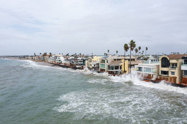October 11, 2006, Long Beach, California, USA: The Long Beach Peninsula is facing severe, structural devastation as Tropical Storm Rachel batters the Southern California coast. Driven by a developing El Nino pattern, this is the fourth major storm system to slam the shoreline in six weeks. Waves and unusually high tides have shattered a 30-foot section of the protective wooden bulkhead, completely shredding the historic boardwalk and allowing seawater to surge directly onto interior streets. Flooding has swamped coastal neighborhoods, forcing mandatory evacuations along oceanfront blocks like Seaside Walk. Emergency crews are working to stack thousands of sandbags and reinforce coastal defenses, but city inspectors have already been forced - ZUMAr19_ 20261011_new_r19_141 Copyright: xRuaridhxStewartx