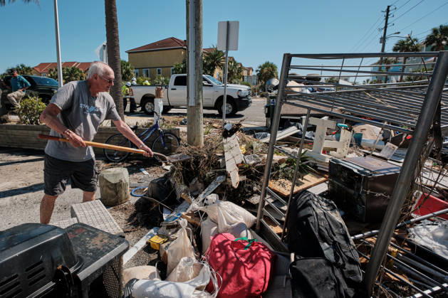 October 11, 2026, Pensacola Beach, Florida, U.S: October 11, 2026 Pensacola Beach, Florida USA: A resident of a storm damaged apartment complex unloads his shovel on a pile of trash while cleaning out his apartment after the arrival of Hurricane Isaias. Pensacola Beach U.S - ZUMAa14_ 20261011_zaf_a14_004 Copyright: xDanxAndersonx