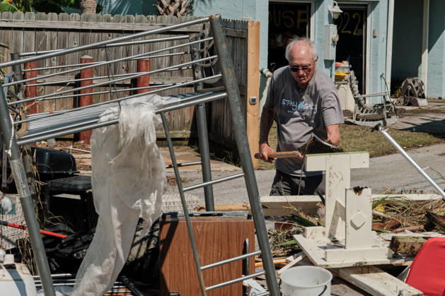 October 11, 2026, Pensacola Beach, Florida, U.S: October 11, 2026 Pensacola Beach, Florida USA: A resident of a storm damaged apartment complex unloads his shovel on a pile of trash while cleaning out his apartment after the arrival of Hurricane Isaias. Pensacola Beach U.S - ZUMAa14_ 20261011_zaf_a14_017 Copyright: xDanxAndersonx
