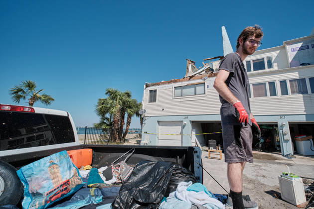 October 11, 2026, Pensacola Beach, Florida, USA: ALEX DEAN loads up the back of his truck with belonging from his storm damaged apartment complex after the arrival of Hurricane Isaias. Pensacola Beach USA - ZUMAa14_ 20261011_zaf_a14_012 Copyright: xDanxAndersonx