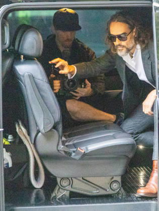 October 12, 2026, London, England, United Kingdom: RUSSELL BRAND arrives at Southwark Crown Court, where he is facing three charges of rape, indecent assault, and three counts of sexual assault, relating to six women. London United Kingdom - ZUMAs262 20261012_zip_s262_005 Copyright: xTayfunxSalcix