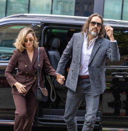 October 12, 2026, London, England, United Kingdom: RUSSELL BRAND with his wife LAURA arrives at Southwark Crown Court, where he is facing three charges of rape, indecent assault, and three counts of sexual assault, relating to six women. London United Kingdom - ZUMAs262 20261012_zip_s262_009 Copyright: xTayfunxSalcix
