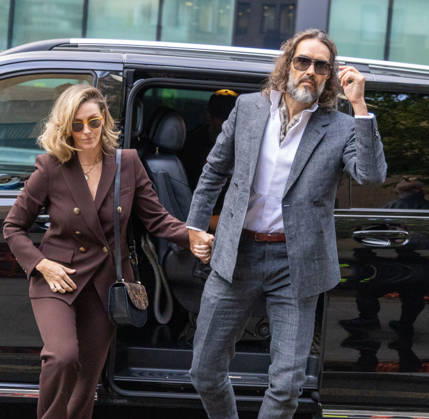 October 12, 2026, London, England, United Kingdom: RUSSELL BRAND with his wife LAURA arrives at Southwark Crown Court, where he is facing three charges of rape, indecent assault, and three counts of sexual assault, relating to six women. London United Kingdom - ZUMAs262 20261012_zip_s262_010 Copyright: xTayfunxSalcix