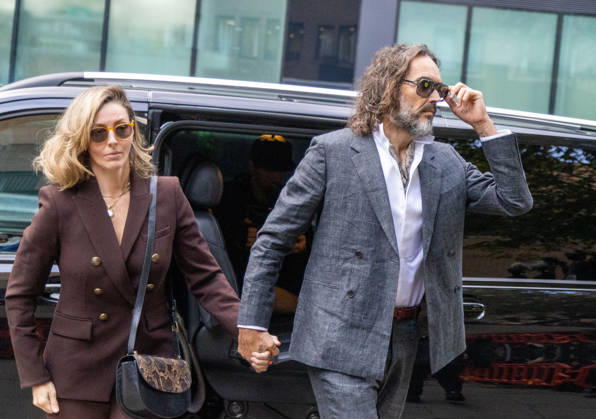 October 12, 2026, London, England, United Kingdom: RUSSELL BRAND with his wife LAURA arrives at Southwark Crown Court, where he is facing three charges of rape, indecent assault, and three counts of sexual assault, relating to six women. London United Kingdom - ZUMAs262 20261012_zip_s262_011 Copyright: xTayfunxSalcix