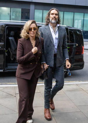 October 12, 2026, London, England, United Kingdom: RUSSELL BRAND with his wife LAURA arrives at Southwark Crown Court, where he is facing three charges of rape, indecent assault, and three counts of sexual assault, relating to six women. London United Kingdom - ZUMAs262 20261012_zip_s262_012 Copyright: xTayfunxSalcix
