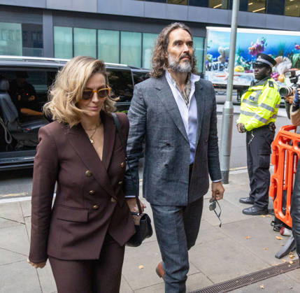 October 12, 2026, London, England, United Kingdom: RUSSELL BRAND with his wife LAURA arrives at Southwark Crown Court, where he is facing three charges of rape, indecent assault, and three counts of sexual assault, relating to six women. London United Kingdom - ZUMAs262 20261012_zip_s262_020 Copyright: xTayfunxSalcix