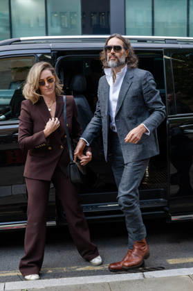 October 12, 2026, London, England, United Kingdom: Actor and comedian Russell BRAND arrives at Southwark Crown Court with his wife, Laura, in London, United Kingdom, on October 12, 2026, as his trial begins on charges of rape, sexual assault and indecent assault. BRAND has pleaded not guilty to all charges. London United Kingdom - ZUMAk172 20261012_zip_k172_005 Copyright: xThomasxKrychx