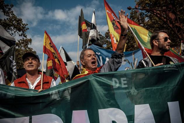 October 12, 2026, Barcelona, Catalonia, Spain: Demonstrators chant slogans behind a banner during a rally marking SpainÃ¢â‚¬â ¢s National Day. Barcelona Spain - ZUMAo105 20261012_fap_o105_003 Copyright: xMatthiasxOesterlex