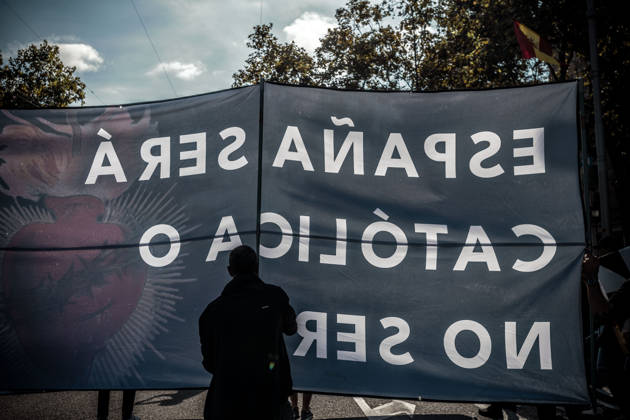 October 12, 2026, Barcelona, Catalonia, Spain: Demonstrators march behind a banner reading Spain will be Catholic, or it will not be. during a rally marking SpainÃ¢â‚¬â ¢s National Day. Barcelona Spain - ZUMAo105 20261012_fap_o105_005 Copyright: xMatthiasxOesterlex