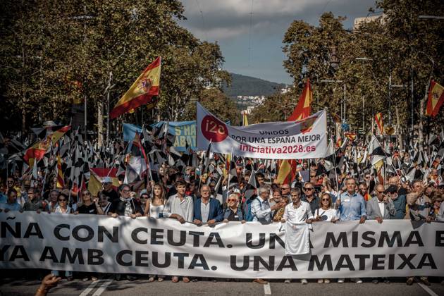October 12, 2026, Barcelona, Catalonia, Spain: Demonstrators march behind a banner reading Catalonia with Ceuta. One Spain during a rally marking SpainÃ¢â‚¬â ¢s National Day Barcelona Spain - ZUMAo105 20261012_fap_o105_014 Copyright: xMatthiasxOesterlex