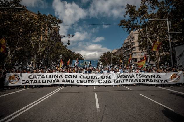 October 12, 2026, Barcelona, Catalonia, Spain: Demonstrators march behind a banner reading Catalonia with Ceuta. One Spain during a rally marking SpainÃ¢â‚¬â ¢s National Day. Barcelona Spain - ZUMAo105 20261012_fap_o105_019 Copyright: xMatthiasxOesterlex