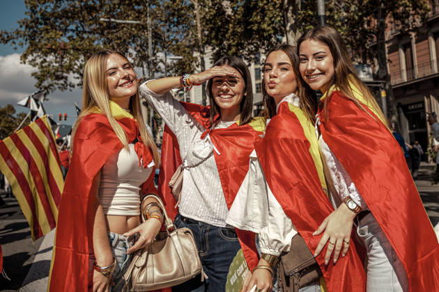 October 12, 2026, Barcelona, Catalonia, Spain: Four women wrapped in Spanish flags pose during a demonstration marking SpainÃ¢â‚¬â ¢s National Day. Barcelona Spain - ZUMAo105 20261012_fap_o105_029 Copyright: xMatthiasxOesterlex