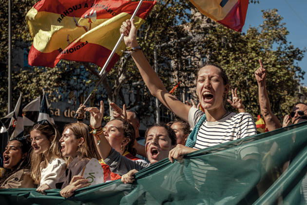 October 12, 2026, Barcelona, Catalonia, Spain: Demonstrators chant slogans behind a banner during a rally marking SpainÃ¢â‚¬â ¢s National Day. Barcelona Spain - ZUMAo105 20261012_fap_o105_026 Copyright: xMatthiasxOesterlex