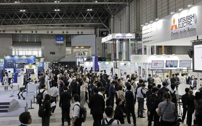 CEATEC electronics show People visit the Combined Exhibition of Advanced Technologies electronics show, known as CEATEC, at the Makuhari Messe convention center in the eastern Japan city of Chiba on Oct. 13, 2026, the opening day of the four-day event.  A14AA0005630735P