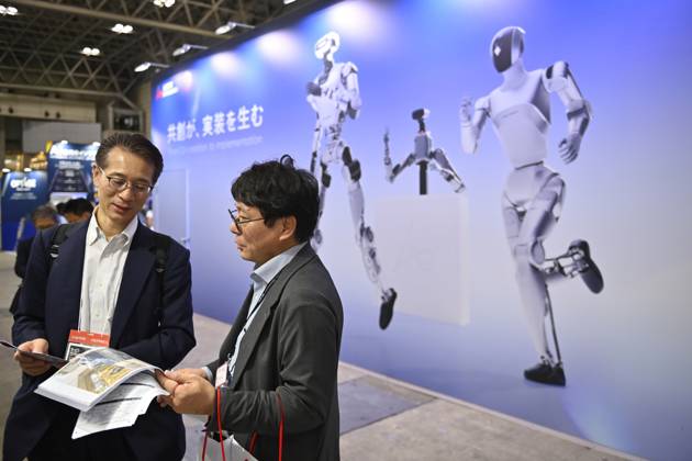 Japan showcases emerging technologies at CEATEC 2026 CHIBA, JAPAN - OCTOBER 13: Visitors explore technology exhibits during CEATEC 2026 at Makuhari Messe in Chiba, Japan, October 13, 2026. The four-day technology exhibition brings together 821 companies and organizations from Japan and abroad, showcasing innovations in artificial intelligence, robotics, digital technology and industrial solutions under the theme ÒTransformation.Ó David Mareuil Anadolu Chiba Japan. Editorial use only. Please get in touch for any other usage.  Copyright: x2026xAnadoluxDavidxMareuilx