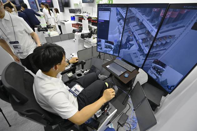 Japan showcases emerging technologies at CEATEC 2026 CHIBA, JAPAN - OCTOBER 13: Visitors explore technology exhibits during CEATEC 2026 at Makuhari Messe in Chiba, Japan, October 13, 2026. The four-day technology exhibition brings together 821 companies and organizations from Japan and abroad, showcasing innovations in artificial intelligence, robotics, digital technology and industrial solutions under the theme ÒTransformation.Ó David Mareuil Anadolu Chiba Japan. Editorial use only. Please get in touch for any other usage.  Copyright: x2026xAnadoluxDavidxMareuilx