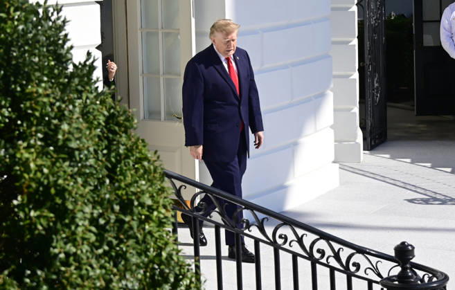 October 13, 2026, Washington, District Of Columbia, USA: United States President Donald J Trump emerges from the Diplomatic Entrance as he departs for a campaign trip to Alaska, Nevada, Arizona and Montana from the South Lawn of the White House in Washington, DC, USA, on Tuesday, October 13, 2026 Washington USA - ZUMAs152 20261013_faa_s152_040 Copyright: xRonxSachs-CNPx