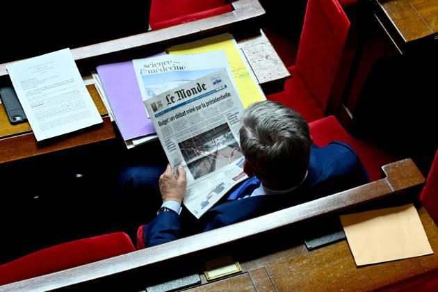 2027 Finance Bill Part One at the National Assembly Illustration of a deputy reading Le Monde newspaper during the 2027 Finance Bill Part One at the National Assembly, French Parliament in Paris, France on octobre 13, 2026. Photo by Tomas Stevens ABACAPRESS.COM Paris France  Copyright: xStevensxTomas ABACAx