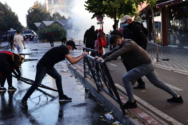 October 13, 2026, Tirana, Albania: TIRANA, ALBANIA, OCTOBER 13, 2026: Student demonstrators clash with riot police outside the Ministry of Education in Tirana during a protest over university conditions, higher education costs and employment prospects. Police deploy tear gas and water cannons as protesters throw bricks and other objects. Several demonstrators are detained. Tirana Albania - ZUMAq101 20261013_zna_q101_259 Copyright: xVlasovxSulajx
