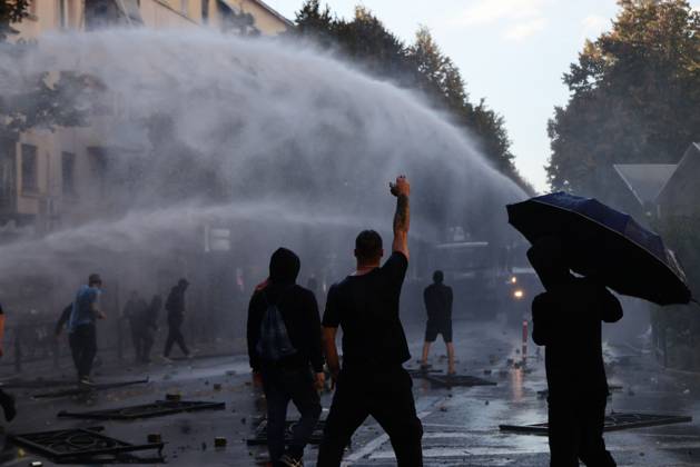 October 13, 2026, Tirana, Albania: TIRANA, ALBANIA, OCTOBER 13, 2026: Student demonstrators clash with riot police outside the Ministry of Education in Tirana during a protest over university conditions, higher education costs and employment prospects. Police deploy tear gas and water cannons as protesters throw bricks and other objects. Several demonstrators are detained. Tirana Albania - ZUMAq101 20261013_zna_q101_265 Copyright: xVlasovxSulajx