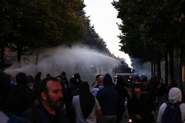 October 13, 2026, Tirana, Albania: TIRANA, ALBANIA, OCTOBER 13, 2026: Student demonstrators clash with riot police outside the Ministry of Education in Tirana during a protest over university conditions, higher education costs and employment prospects. Police deploy tear gas and water cannons as protesters throw bricks and other objects. Several demonstrators are detained. Tirana Albania - ZUMAq101 20261013_zna_q101_270 Copyright: xVlasovxSulajx