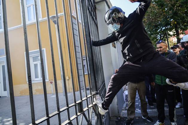 October 13, 2026, Tirana, Albania: TIRANA, ALBANIA, OCTOBER 13, 2026: Student demonstrators clash with riot police outside the Ministry of Education in Tirana during a protest over university conditions, higher education costs and employment prospects. Police deploy tear gas and water cannons as protesters throw bricks and other objects. Several demonstrators are detained. Tirana Albania - ZUMAq101 20261013_zna_q101_279 Copyright: xVlasovxSulajx