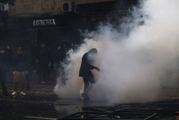 October 13, 2026, Tirana, Albania: TIRANA, ALBANIA, OCTOBER 13, 2026: Student demonstrators clash with riot police outside the Ministry of Education in Tirana during a protest over university conditions, higher education costs and employment prospects. Police deploy tear gas and water cannons as protesters throw bricks and other objects. Several demonstrators are detained. Tirana Albania - ZUMAq101 20261013_zna_q101_280 Copyright: xVlasovxSulajx
