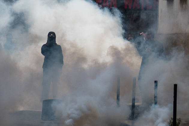 High School Stdent Mobilisation - Bordeaux A protester with their face covered and wearing protective goggles stands in a thick cloud of tear gas during Act V of the high school student mobilisation in Bordeaux, France on October 13, 2026. Photo by Fabrice Sapte ABACAPRESS.COM Bordeaux France  Copyright: xSaptexFabrice ABACAx