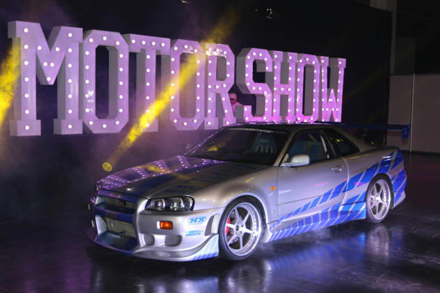 Nissan Skyline R34 GT-R (Baujahr 1999, original Filmfahrzeug aus 2 Fast 2 Furious von 2003) des Aussteller ChromeCars vor Schriftzug Motor Show, Medientermin Carwalk zur Essen Motor Show am 14.10.2026 in der Messe Essen im Vorfeld der Essen Motor Show 2026 (28.11.-06.12.2026, EMS Preview 27.11.2026)