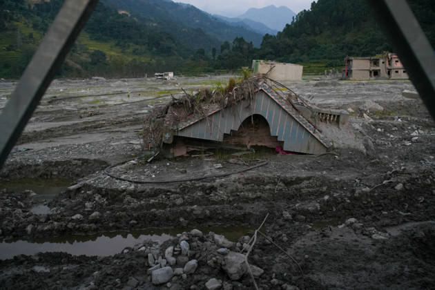 Aftermath of flash floods in Nepal NUWAKOT, NEPAL - OCTOBER 14 : Houses damaged by devastating flash floods are seen in Betrabati, Nuwakot district, Nepal on October 14, 2026. Road and pedestrian connectivity has been restored with the construction of a new suspension bridge over the Trishuli River, allowing local residents to cross the river after the devastating floods damaged bridges and other infrastructure in the area. Sunil Pradhan Anadolu Nuwakot Nepal. Editorial use only. Please get in touch for any other usage.  Copyright: x2026xAnadoluxSunilxPradhanx