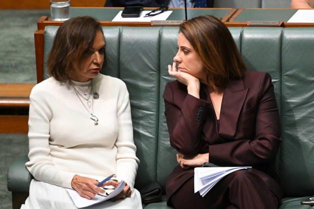 QUESTION TIME, Australian Small Business Minister Anne Aly speaks to Australian Communications Minister Anika Wells during Question Time in the House of Representatives at Parliament House in Canberra, Thursday, October 15, 2026. ( NO ARCHIVING CANBERRA AUSTRALIAN CAPITAL TERRITORY Australia  Copyright: xLUKASxCOCHx 20261015163776342366
