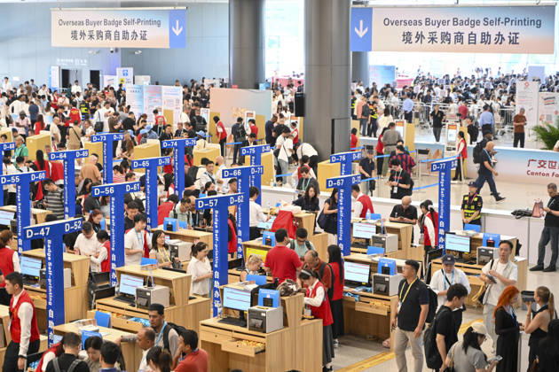 GUANGZHOU, CHINA - OCTOBER 15: Overseas buyers handle entry credentials at the registration hall of the 140th China Import and Export Fair (Canton Fair) on October 15, 2026 in Guangzhou, Guangdong Province of China. The fair runs in three phases until November 4, covering a total exhibition area of 1.55 million square meters.  Copyright: xChinaxNewsxServicex 111674428650