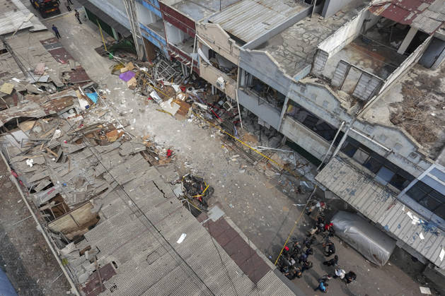 Blast at Indonesian market kills 2, injures 11 in South Tangerang BANTEN, INDONESIA - OCTOBER 15: An aerial view shows damaged shop-house buildings and debris scattered across the site of an explosion at a market in South Tangerang, on the outskirt of Jakarta, Indonesia, on October 15, 2026. The blast killed two people and injured at least 11 others, according to police. Investigators are examining the cause of the explosion after finding an ethylene gas cylinder at the site. The blast damaged shop-house buildings and scattered debris across the surrounding commercial area. Agoes Rudianto Anadolu Banten Indonesia. Editorial use only. Please get in touch for any other usage.  Copyright: x2026xAnadoluxAgoesxRudiantox