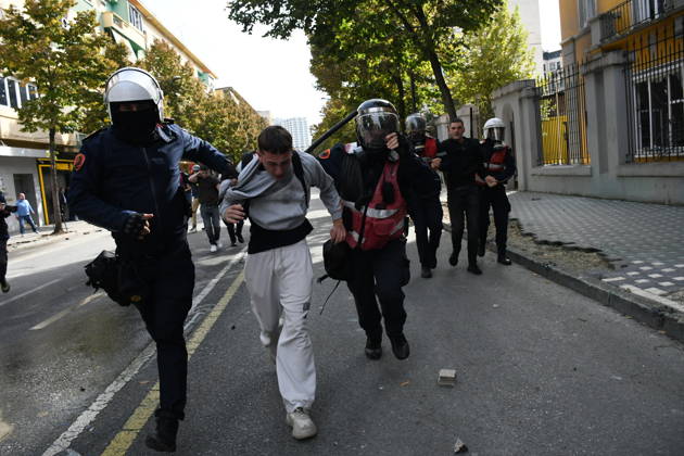 Student protests demanding improved educational conditions continue in Albania TIRANA, ALBANIA - OCTOBER 15: Riot police detain a protester during the third day of demonstrations demanding improved educational conditions in Tirana, Albania, on October 15, 2026. University students are joined by high school students and local residents as tensions escalate, with police using tear gas to disperse demonstrators outside the Ministry of Education and the Parliament building, while protesters throw stones and other objects at police officers. Olsi Shehu Anadolu Tirana Albania. Editorial use only. Please get in touch for any other usage.  Copyright: x2026xAnadoluxOlsixShehux