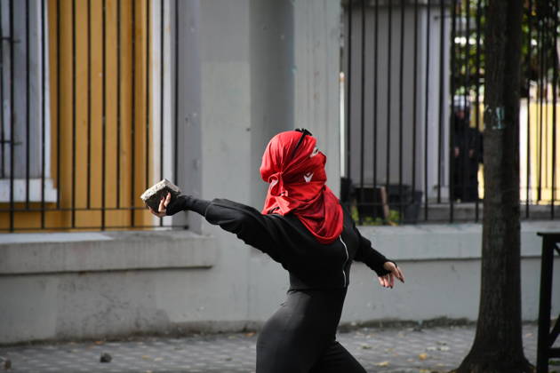 Student protests demanding improved educational conditions continue in Albania TIRANA, ALBANIA - OCTOBER 15: A masked protester prepares to throw a stone during clashes with police on the third day of demonstrations demanding improved educational conditions in Tirana, Albania, on October 15, 2026. University students are joined by high school students and local residents as tensions escalate, with police using tear gas to disperse demonstrators outside the Ministry of Education and the Parliament building, while protesters throw stones and other objects at police officers. Olsi Shehu Anadolu Tirana Albania. Editorial use only. Please get in touch for any other usage.  Copyright: x2026xAnadoluxOlsixShehux