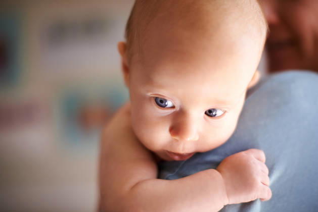 Baby, relax and hug with cuddle for newborn childcare, parenting or treatment in home. Girl, child or infant with embrace, love or parenthood for innocence or sense of peace and harmony in house. model released property released Copyright: xx