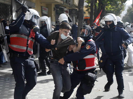 Protesters Clash with Police During a Demonstration in Tirana, Albania. Riot police detain a protester during an anti-government demonstration in central Tirana on October 15, 2026, as protests continued for a third consecutive day over university conditions and demands for the resignation of Albanian Prime Minister Edi Rama. The latest rally follows two nights of violence in the capital, during which protesters and riot police clashed, police used water cannons and tear gas, and demonstrators damaged government offices and shops and set fire to several buildings. Light Studio Agency Malton Dibra Tirana Albania Copyright: xLightxStudioxAgencyx xMaltonxDibrax