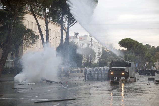 Protesters Clash with Police During a Demonstration in Tirana, Albania. A police unit moves alongside a water cannon during clashes with protesters at an anti-government demonstration in central Tirana on October 15, 2026, as protests continued for a third consecutive day over university conditions and demands for the resignation of Albanian Prime Minister Edi Rama. The latest rally follows two nights of violence in the capital, during which protesters and riot police clashed, police used water cannons and tear gas, and demonstrators damaged government offices and shops and set fire to several buildings. Light Studio Agency Malton Dibra Tirana Albania Copyright: xLightxStudioxAgencyx xMaltonxDibrax