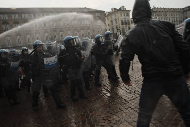 October 16, 2026, Turin, Italy: TURIN, ITALY, OCTOBER 16, 2026: Students demonstrate against deteriorating school buildings, insufficient education funding and job insecurity, calling for greater investment in education rather than military spending. Clashes break out in Piazza Castello, where police use water cannons and charge demonstrators. Earlier along the route, teachers link arms between students and police to prevent confrontation. Turin Italy - ZUMAq101 20261016_zna_q101_136 Copyright: xJulianxNelajx